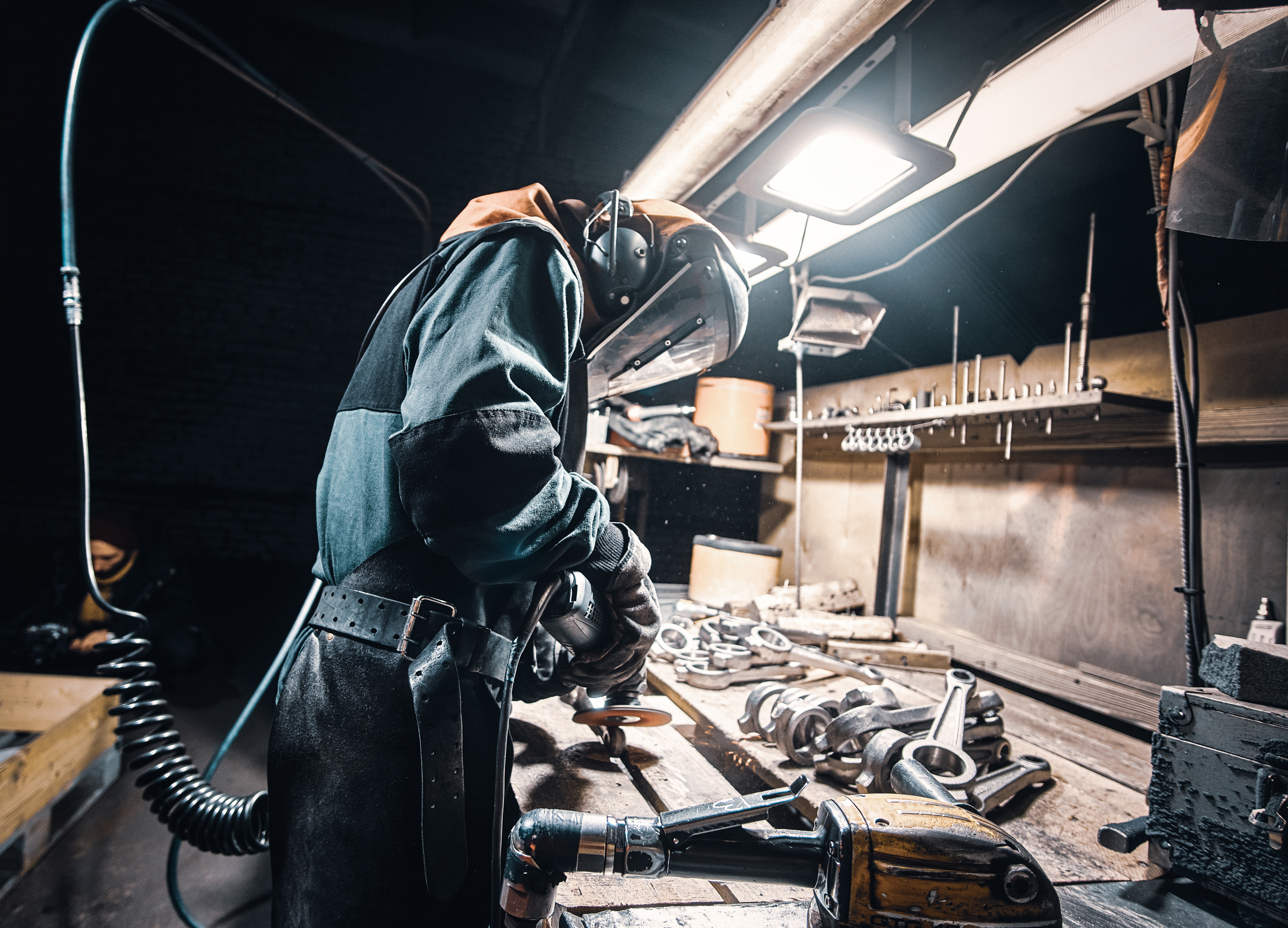 Man in uniform welding